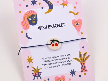 Brăţară nod culisant și mărgea cu cireșe decorate manual cu aur. Mărgea: 2x2 cm. Deschidere: 8-4 cm. Produs și manufacturat de Gruni, Timișoara.
